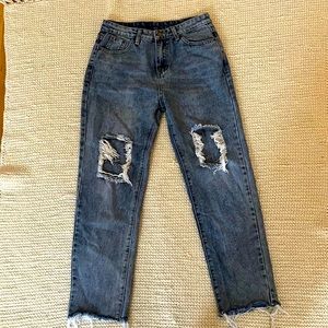 Distressed Blue Jeans. Boyfriend Cut, full legs. Size 4. In Excellent Condition